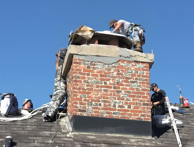 East Los Angeles Chimney Sweep installing a custom chimney crown in East Los Angeles, CA