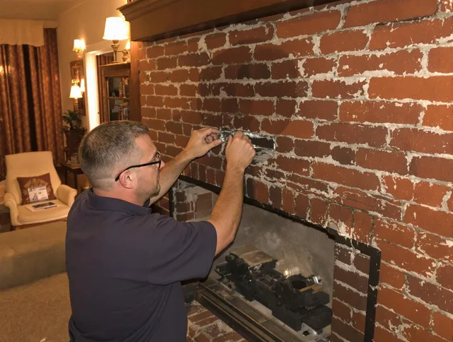 East Los Angeles Chimney Sweep expert fixing a fireplace in East Los Angeles, CA